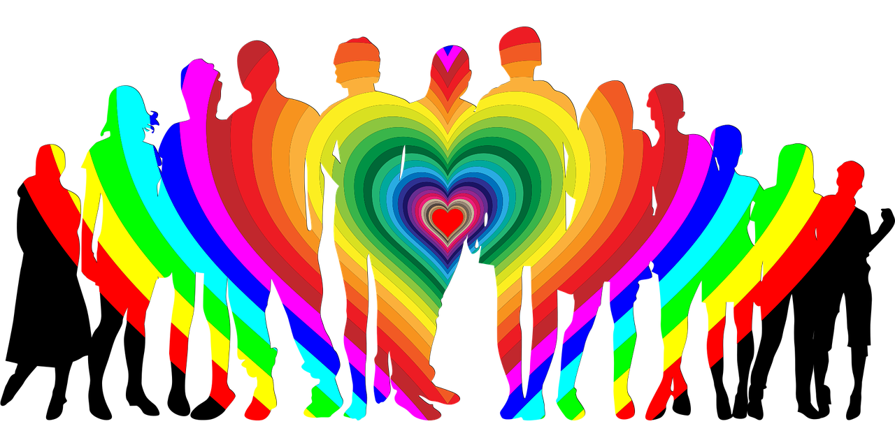 Symbolbild Diversität. Ein Herz in Regenbogenfarben umfasst unterschiedliche Menschen.